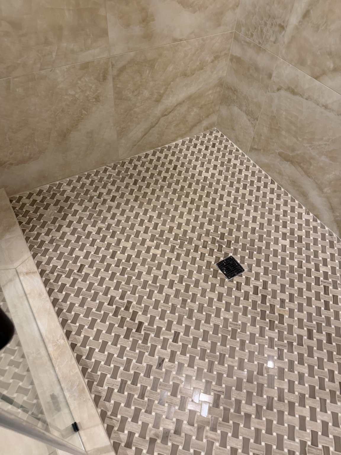 Basketweave tile shower floor with square drain