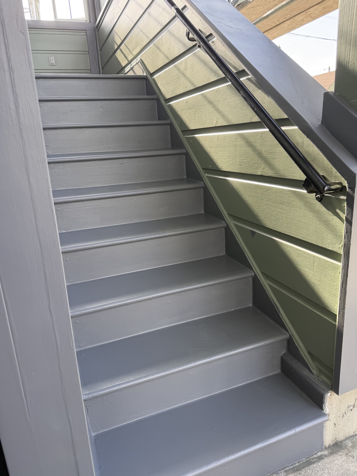 Freshly painted gray exterior stairs