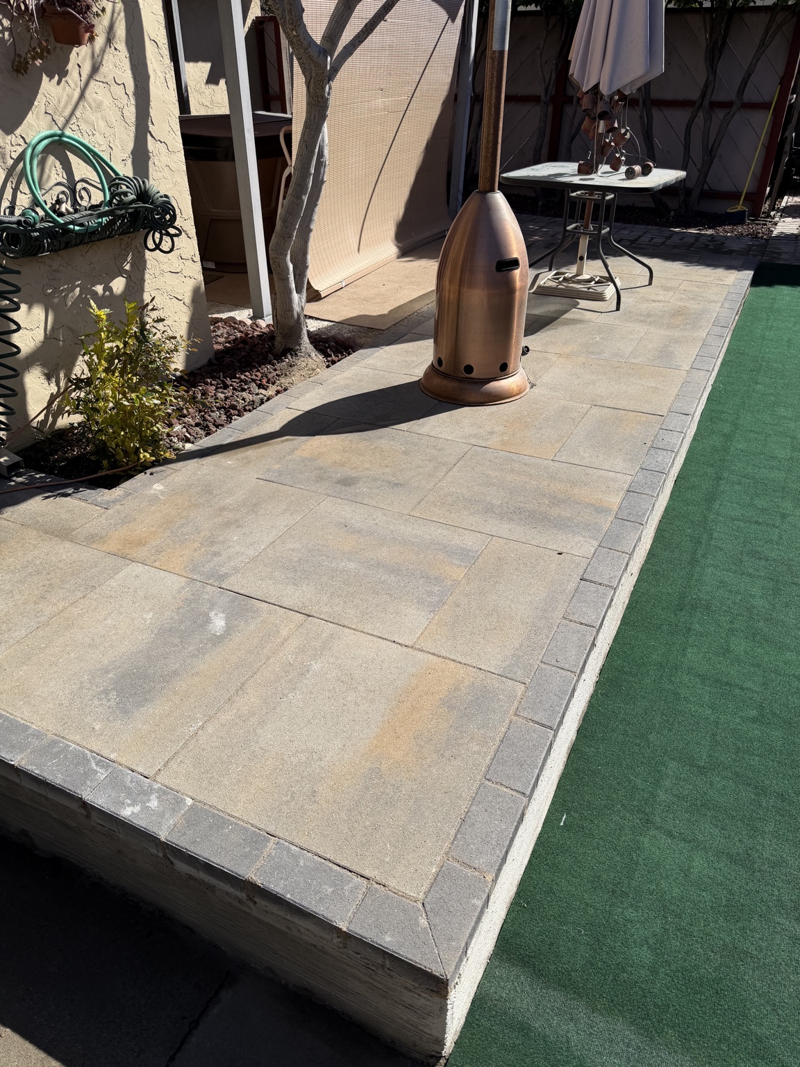 Finished paver patio with a dark border